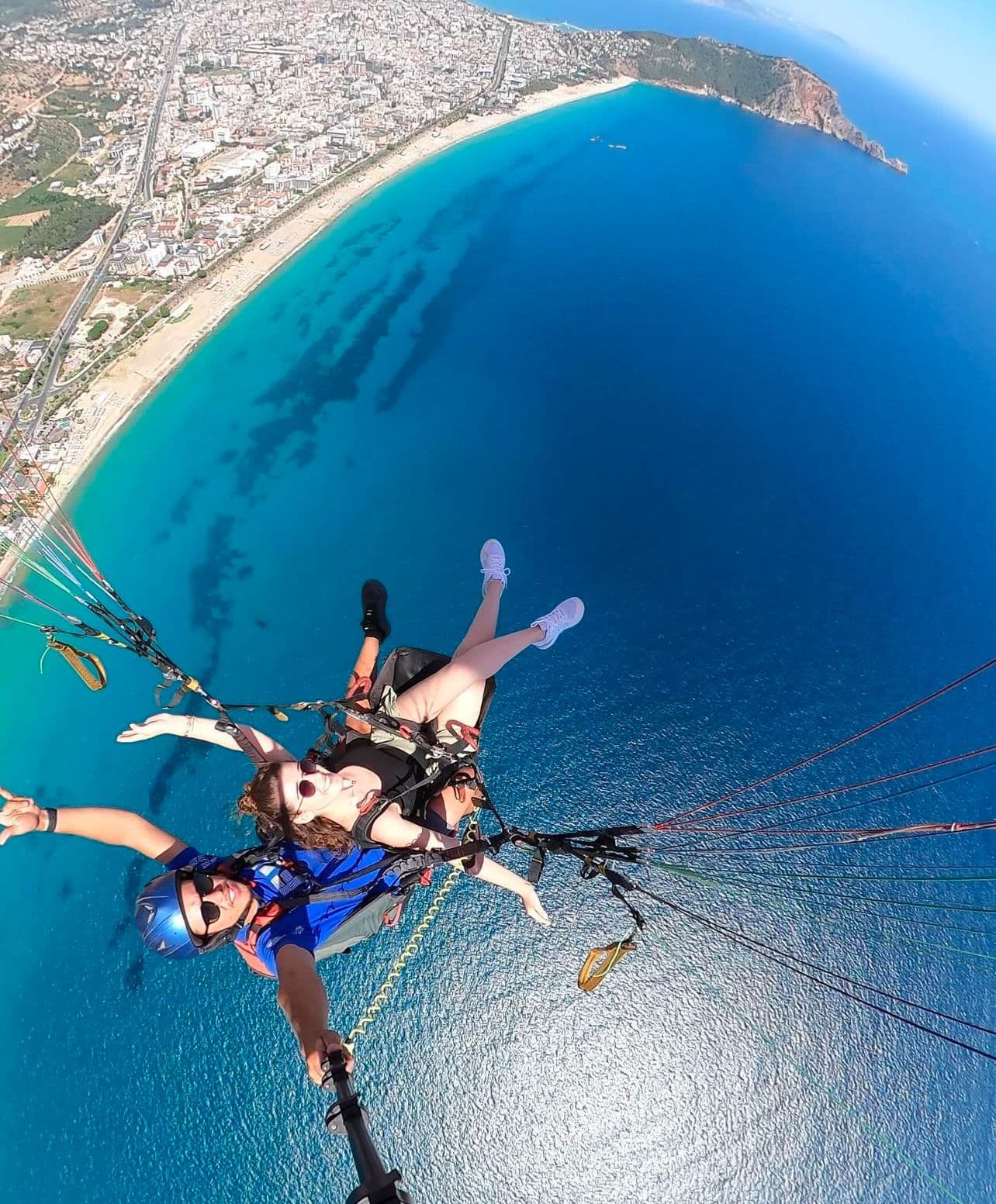 In-flight view of Cleopatra Beach from a tandem paraglider